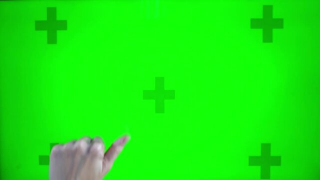 click of the hand on background of chroma key on computer monitor. Green screen on mock up background chromakey woman's hand presses touch. Choose product in online store. View catalog on website