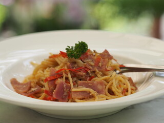 Spaghetti with Garlic, Dried Chili and Bacon in white plate, food