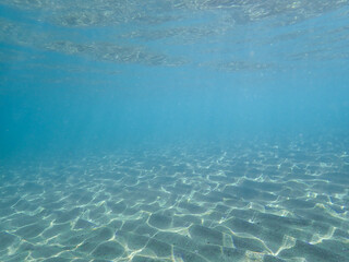 Tropical blue ocean with white sand underwater in Hawaii, underwater blue ocean wide background with sandy sea bottom, Real natural underwater view of the Mediterranean Sea, , Ocean background