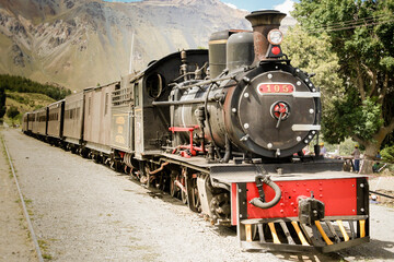 Fototapeta premium old locomotive train in the mountains, in Chubut, Patagonia Argentina during summer