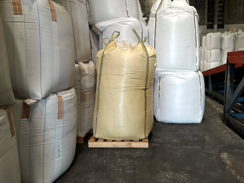 Stock pile Chemical fertilizer jumbo-bag in warehouse waiting for shipment.
