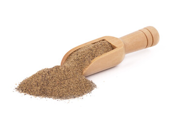 Closeup black pepper seeds or peppercorns in scoop isolated on white background