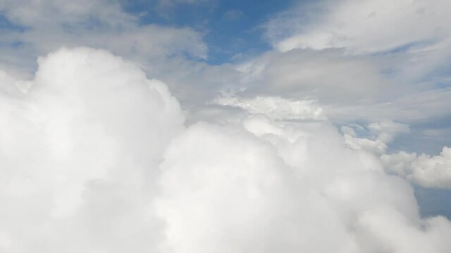 dive in to a fluffy smooth cotton white clouds, Flying through amazingly beautiful heavenly clouds sky. fly on the high sky good atmosphere. dreamy clouds in heaven. sky and clouds from plain window. 