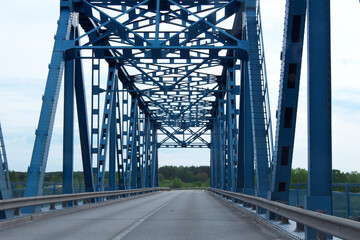 Steel bridge in blue. Photo inside the bridge.