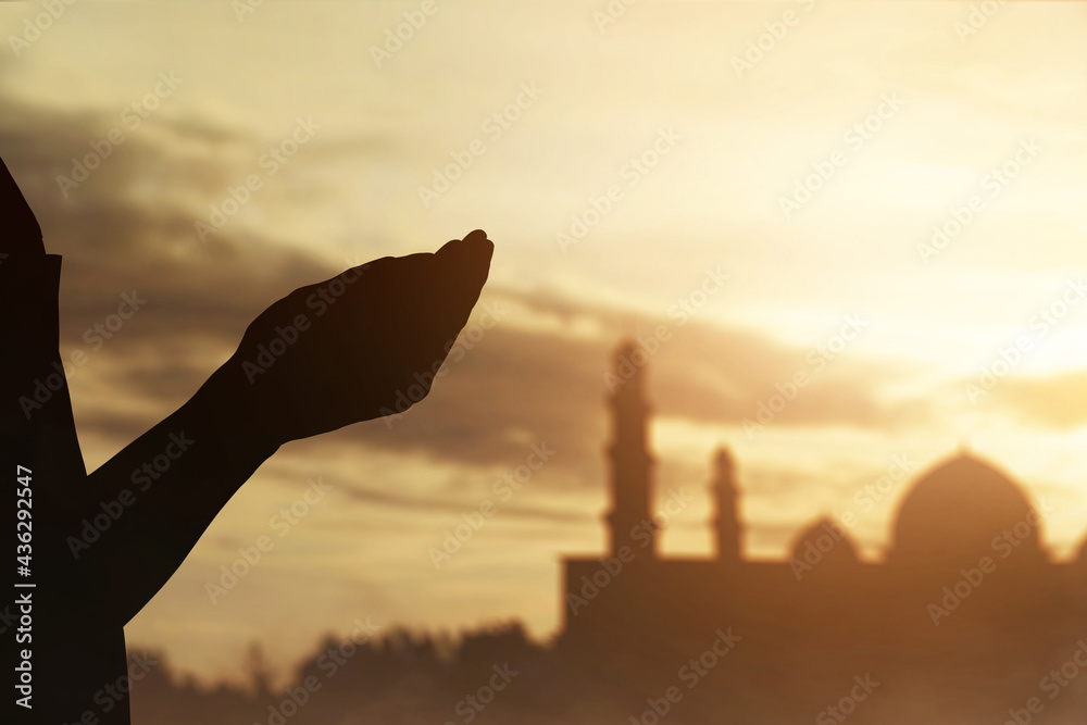 Wall mural silhouette of hands muslim man praying