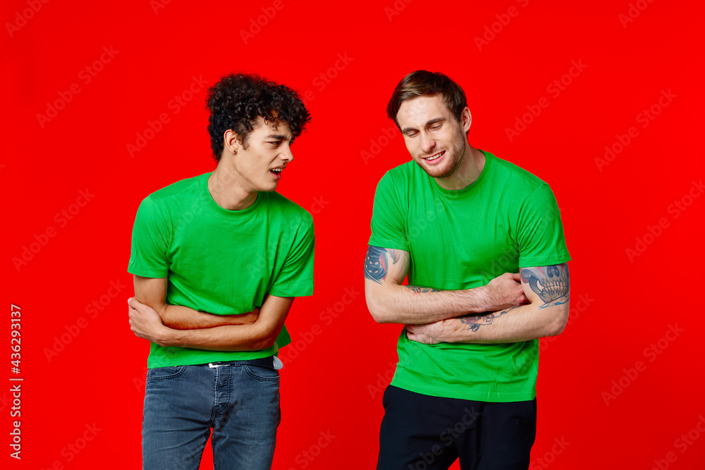 Wall mural two man holding his neck emotions discontent red background