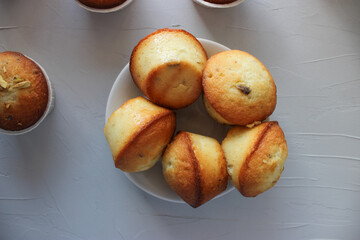 Lemon muffins sprinkled with chopped pistachios.