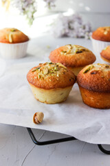 Lemon muffins sprinkled with chopped pistachios.