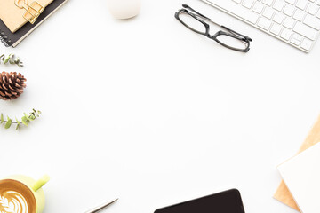 White female office desk table with computer tools, cup of coffee and office supplies. Top view with copy space, flat lay.
