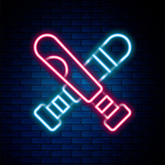 Glowing neon line Crossed baseball bat icon isolated on brick wall background. Colorful outline concept. Vector