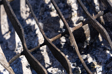 Broken, crooked outdoor bbq grid 