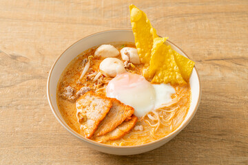 Rice vermicelli noodles with meatball, roasted pork and egg in spicy soup