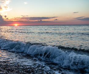 Water by the sea at sunset.