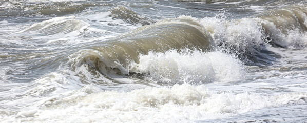 Splashing big waves on the seashore.