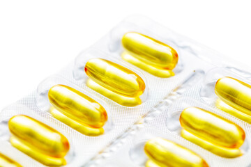 Yellow transparent pills of fish oil