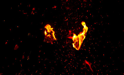 Sparks from fire on a black