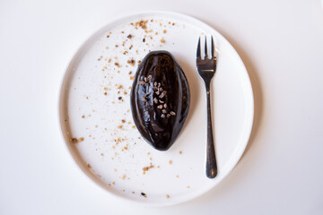 Tasty cocoa pie on a white plate.