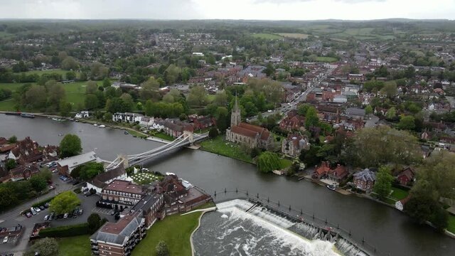 Marlow town and weir on river Thames Buckinghamshire UK aerial high point of view footage 4K