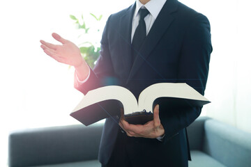 Cropped image of lawyer holding law book