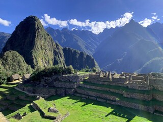 Machu Picchu great Inca lost city in Peru. Ancient Incas fortress in Andes mountains.  Panorama of Huyana Picchu Mount. Ancient civilization landmark in South America..