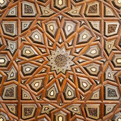 Closeup of wooden arabesque decorations tongue and groove assembled, inlaid with ivory and ebony, on Minbar of Imam Al Shafii public Mosque, Old Cairo, Egypt