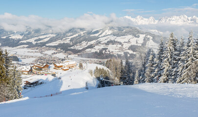 Panoramic view of Ski slopes at Kirchberg in Tirol, part of the Kitzbühel ski area in Austria. - obrazy, fototapety, plakaty