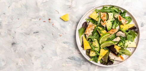chicken, fresh lettuce, pineapple, avocado salad. Long banner format, top view