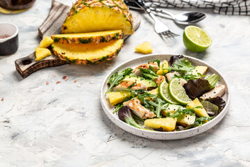 Healthy lunch with grilled chicken, fresh lettuce, pineapple, avocado salad. selection of healthy food