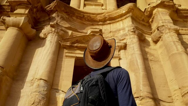Explorer Viewing Petra Ruins in Awe
