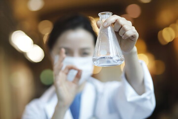 Doctor holding flask. Biotechnology,medicine,chemistry concept