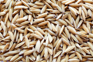 Dry organic rice seed background, for agricultural product or food raw material concept