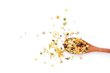 Mixed dry organic cereal and grain seeds in wooden spoon on white background