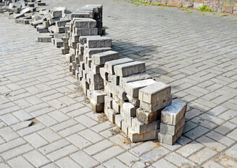 Long stack of disassembled paving tiles