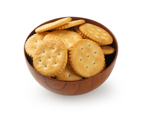 Cracker cookies in wooden bowl isolated on white background with clipping path.