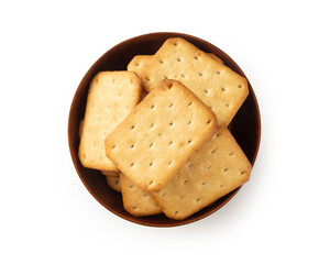 Cracker cookies in wooden bowl isolated on white background with clipping path.