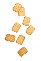 Cracker cookies falling isolated on white background with clipping path.
