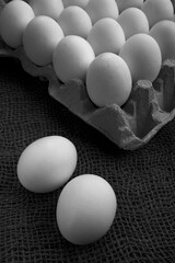 chicken eggs on the table. Farm products, natural eggs in jute background.