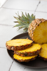 Ripe juicy pineapple cut into rings close-up
