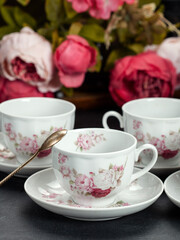 Fototapeta na wymiar cup of tea and roses