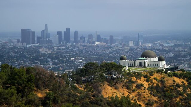 Time Lapse Lockdown Shot Of People At Griffith Observatory In City, Residential District Against Cloudy Sky - Los Angeles, California