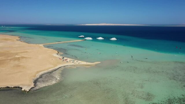 Aerial view: Kitesurfing in Red sea on Jazirat Jaysum island, Egypt