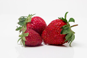 Strawberries on a white background. Fresh ripe strawberries. Healthy diet.