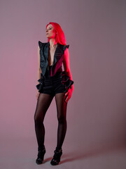 Goth sexy look. young attractive woman with pink hair