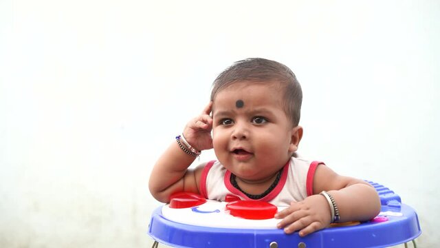 Cute Indian small baby boy, isolated over white background