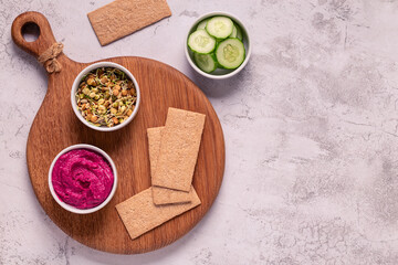 beetroot hummus, sprouted grains, cucumber, and whole grain crisps