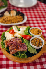 Pihtije i Duvan cvarci - traditional Balkan food. Dish in restarurant.