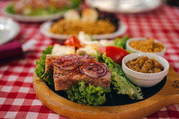 Pihtije i Duvan cvarci - traditional Balkan food. Dish in restarurant.