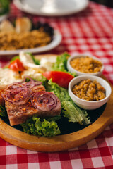 Pihtije i Duvan cvarci - traditional Balkan food. Dish in restarurant.