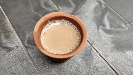 A kulhar or kulhad cup (traditional handle-less clay cup) from North India filled with hot Indian tea