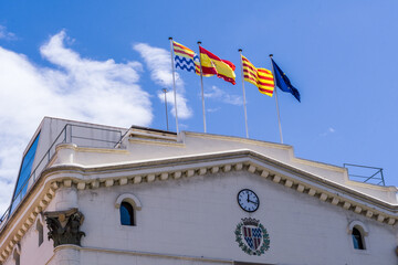 Badalona, Spain - May 13, 2021. Badalona City Council and local, national and European flag waving - obrazy, fototapety, plakaty